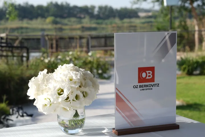 White flowers and a branded programme at the conference reception