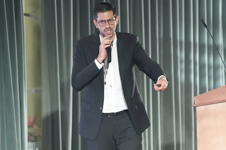 A conference speaker addressing the audience