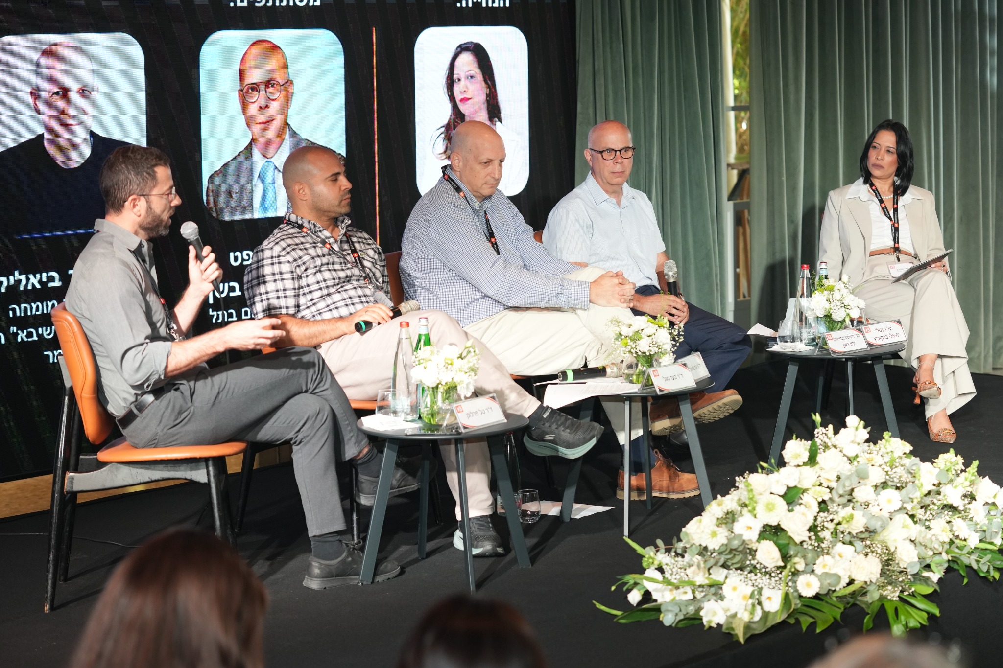 Five participants in the conference panel discussion